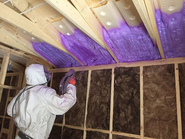 Four Seasons Insulation contractor installing spray foam roof insulation
