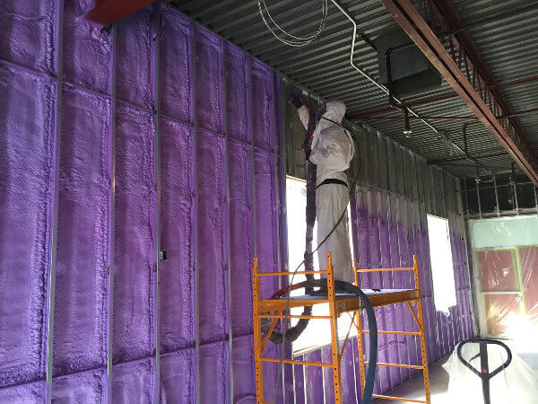 Spray foam insulated building interior performed by Four Seasons contractor