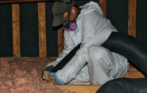 attic insulation contractor installing new attic insulation